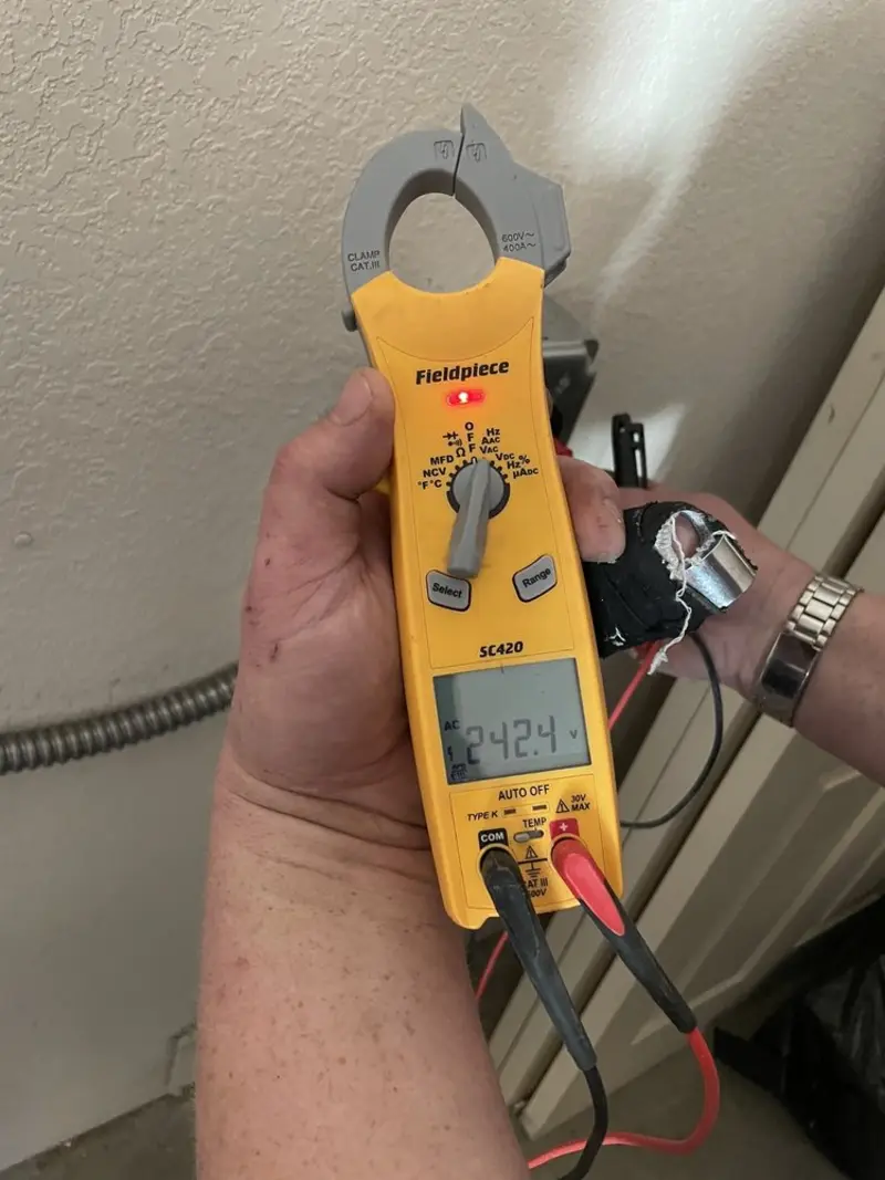 Voltage testing with clamp meter during Generator Installation in Sauk Rapids